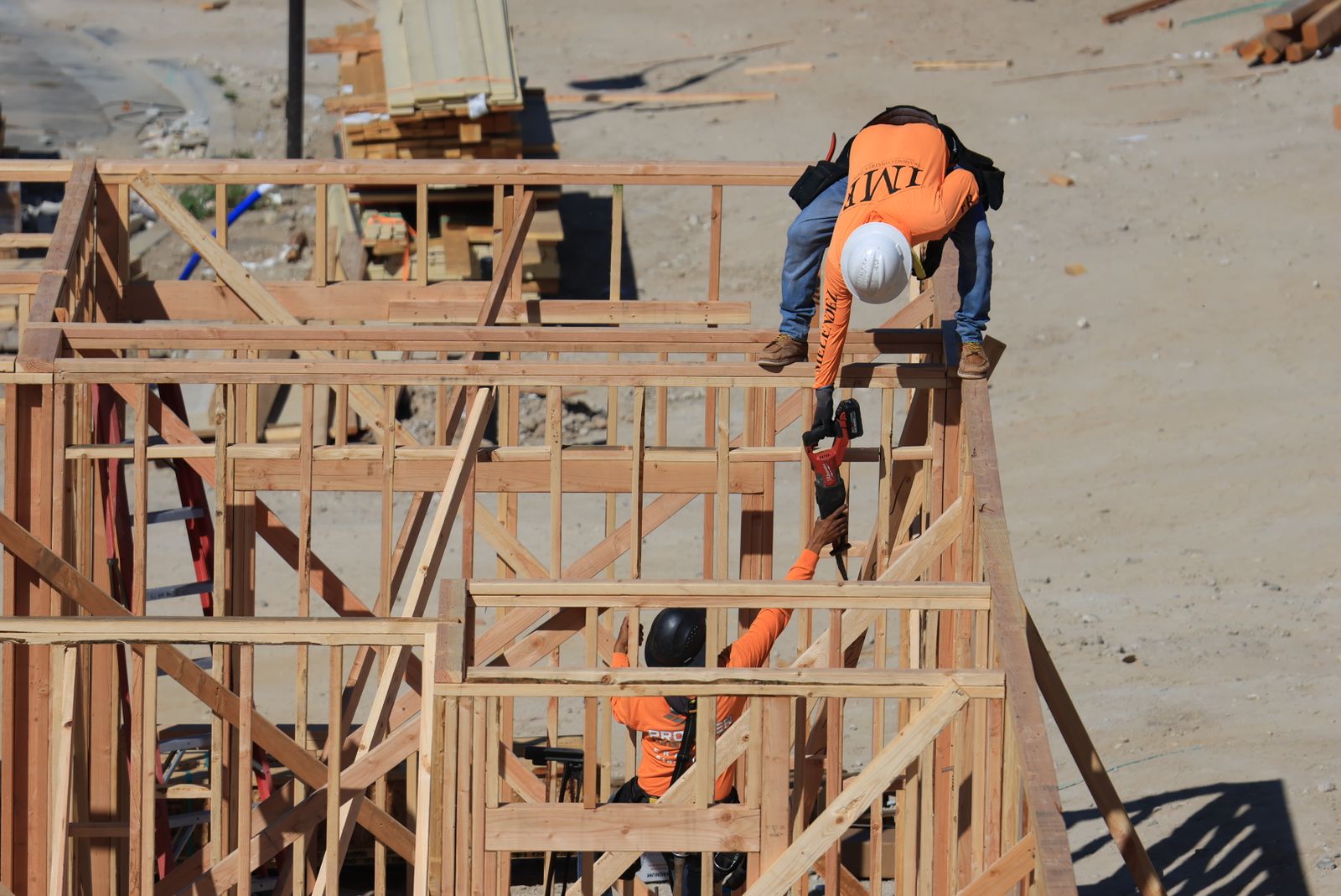 Framing crew running interior walls